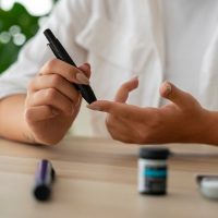 front-view-diabetic-woman-checking-her-glucose-level_23-2150756393